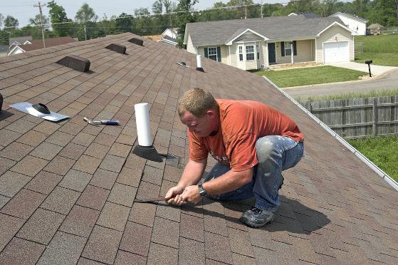 Roofer inspecting a roof in Santa Rosa
